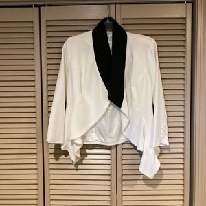 Cute jacket never worn still has an extra button attached.